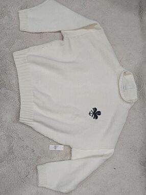 Maeve Cream Turtleneck Sweater with Black Clover Motif